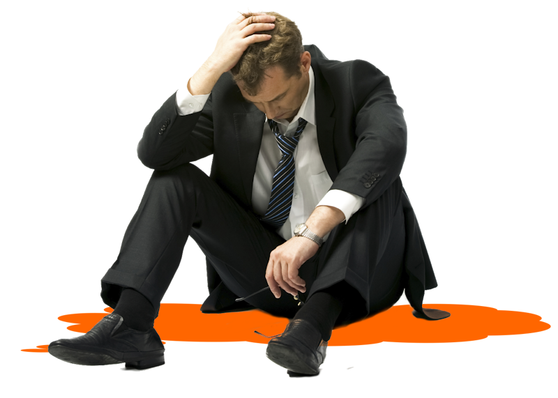 Problematic male programmer sitting down on the pavement